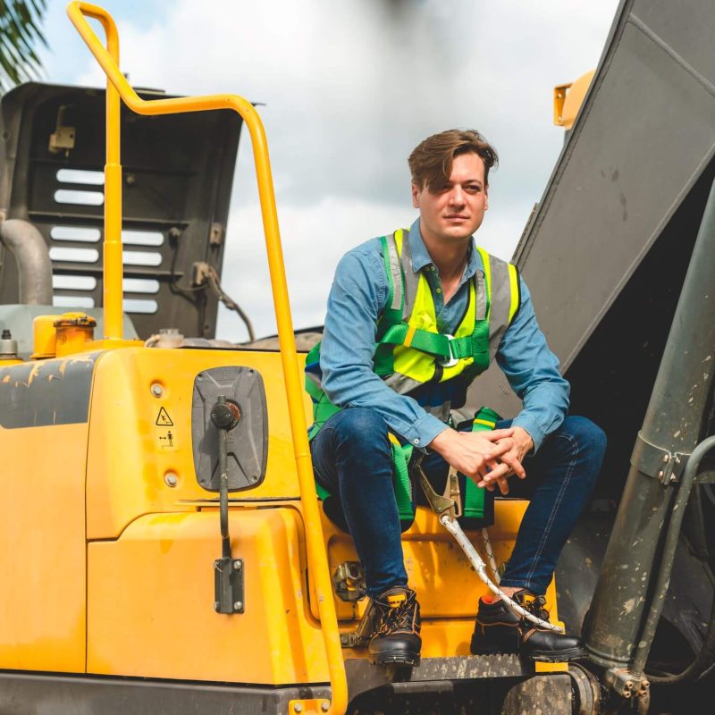 construction-worker-person-with-backhoe-loader-or-2025-03-28-09-11-24-utc